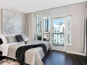 Bedroom with city view balcony
